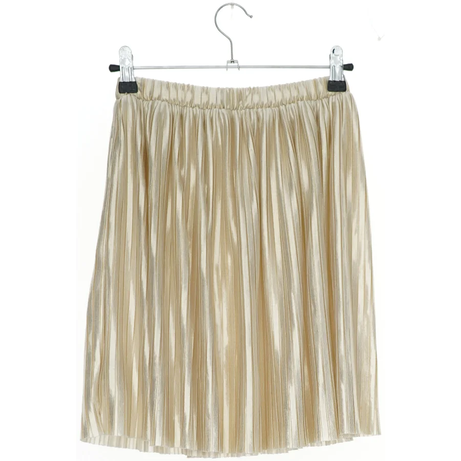 Plisseret nederdel i beige fra H&M (str. 116)
