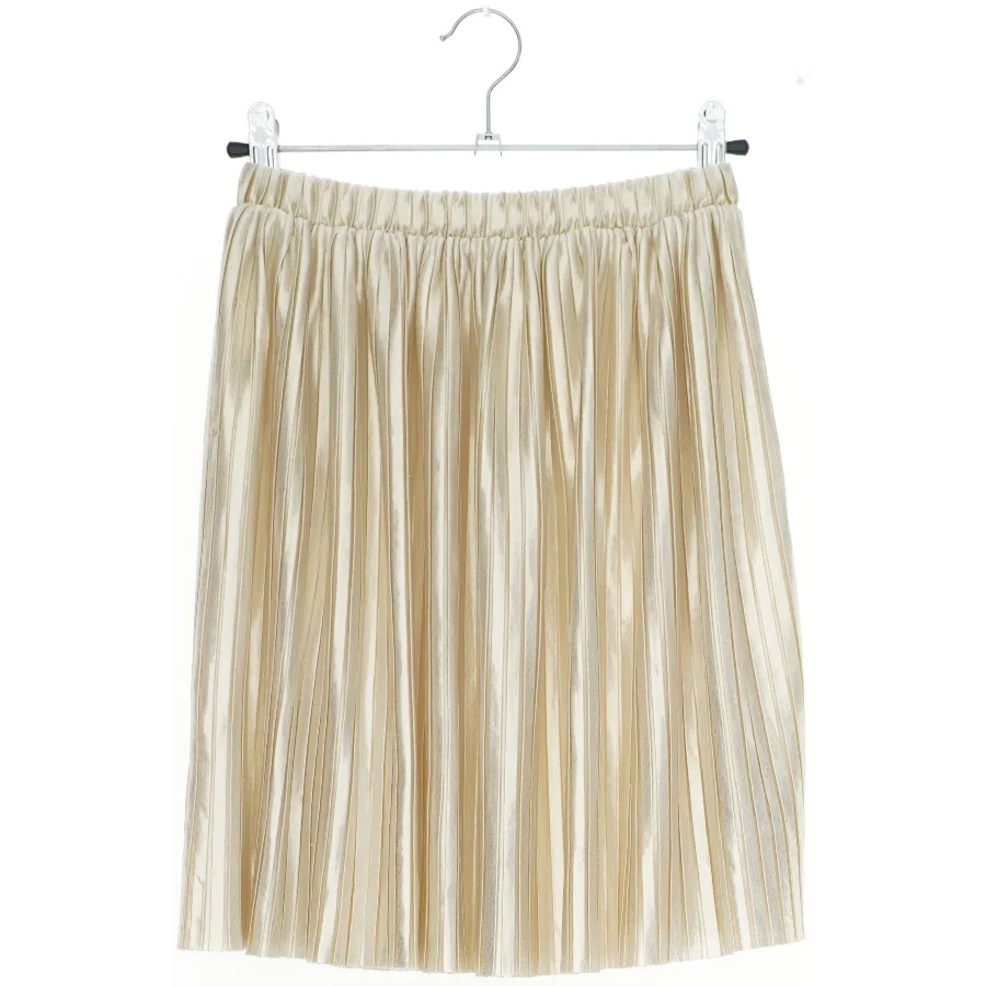 Plisseret nederdel i beige fra H&M (str. 116)