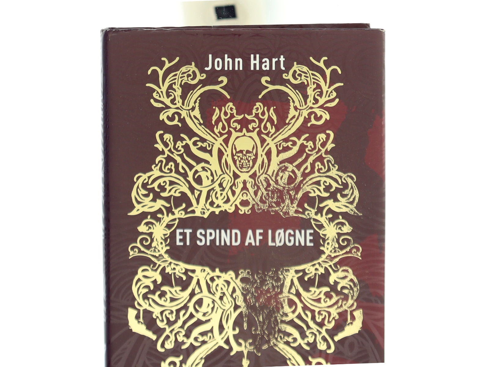 Et spind af løgne af John Hart (f. 1965) (Bog)