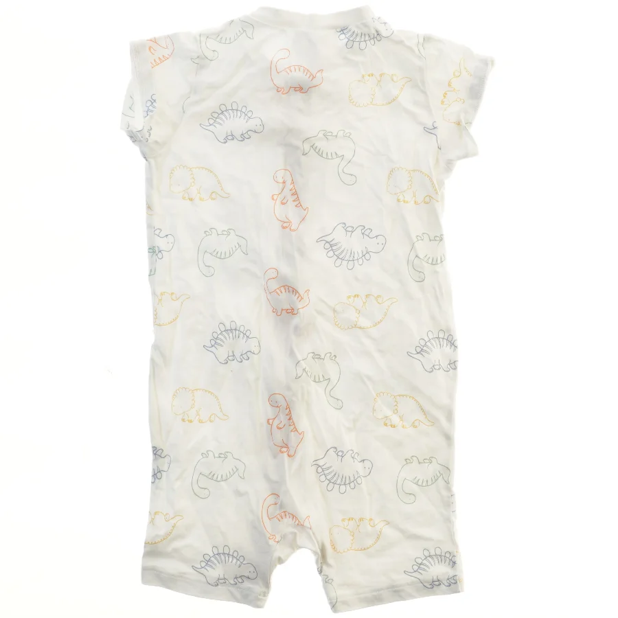 Kortærmet sparkedragt med dinosaurprint fra H&M (str. 92)