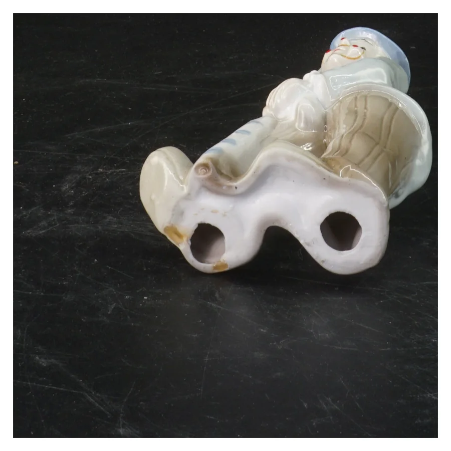 Porcelænsfigur af mand (str. 17x8,5 cm)