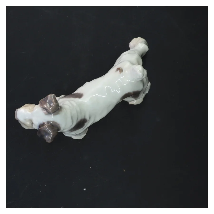 Porcelænsfigur af hund fra Royal Copenhagen (str. 15x14 cm)