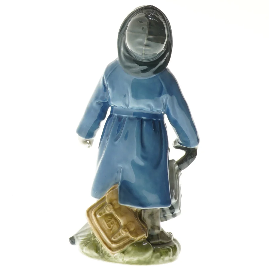Porcelænsfigur med frakke og paraply fra Royal Copenhagen (str. 18,5 cm)