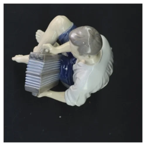 Porcelænsfigur af harmonikaspiller fra Royal Copenhagen (str. 22x12 cm)