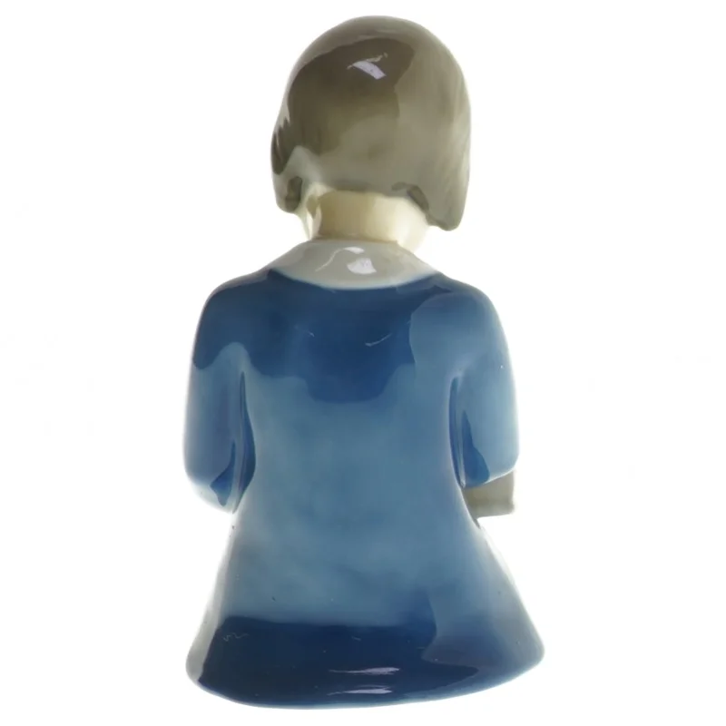 Porcelænsfigur af barn læsende fra B&G (str. 11x11,5 cm)