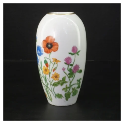 Porcelænsvase med blomsterdekoration (str. 16 cm)