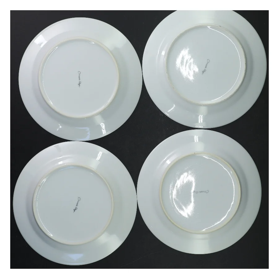 Sæt af fire tallerkener med julemotiv fra Mads Stage (str. Ø 19 cm)