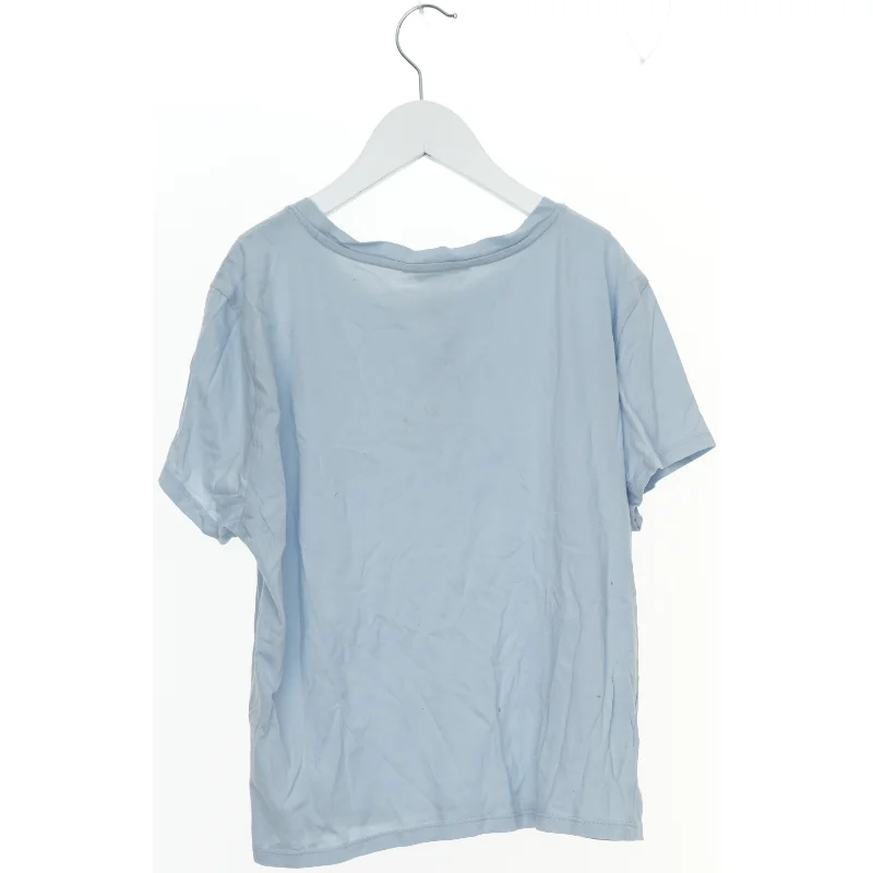 Lyseblå T-shirt med kvindetegn symbol fra Monki (str. M)