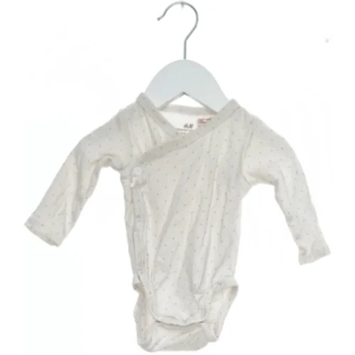 Langærmet bodystocking med prikker fra H&M (str. 56)