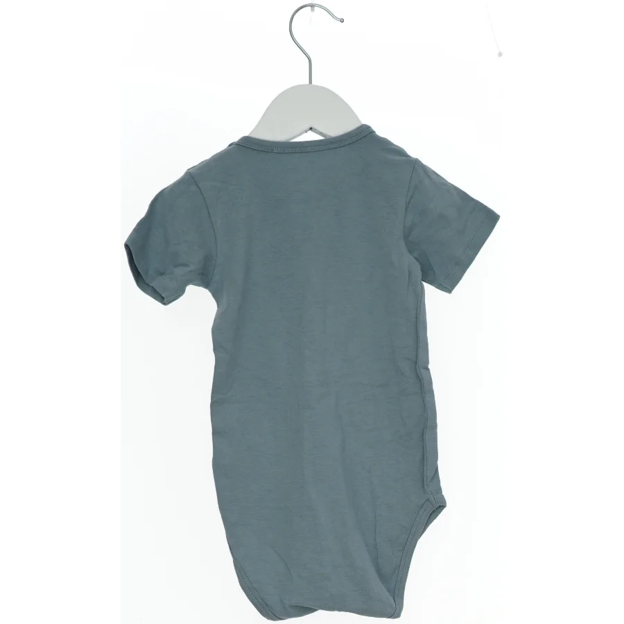 Grå bodystocking med dinosaur print fra Petit (str. 92)