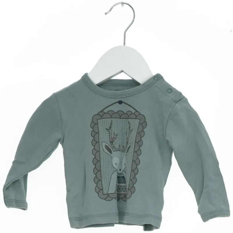 Langærmet bluse med motiv fra Fixoni (str. 62)