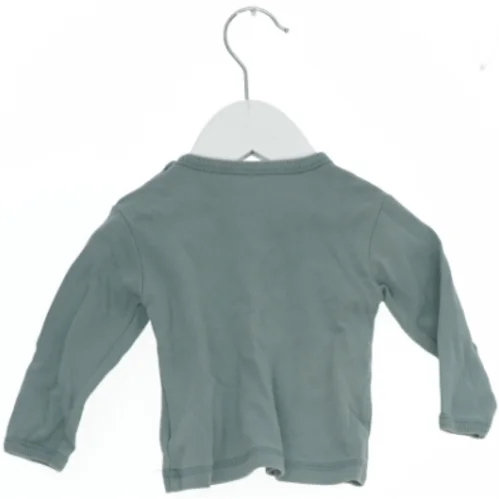 Langærmet bluse med motiv fra Fixoni (str. 62)