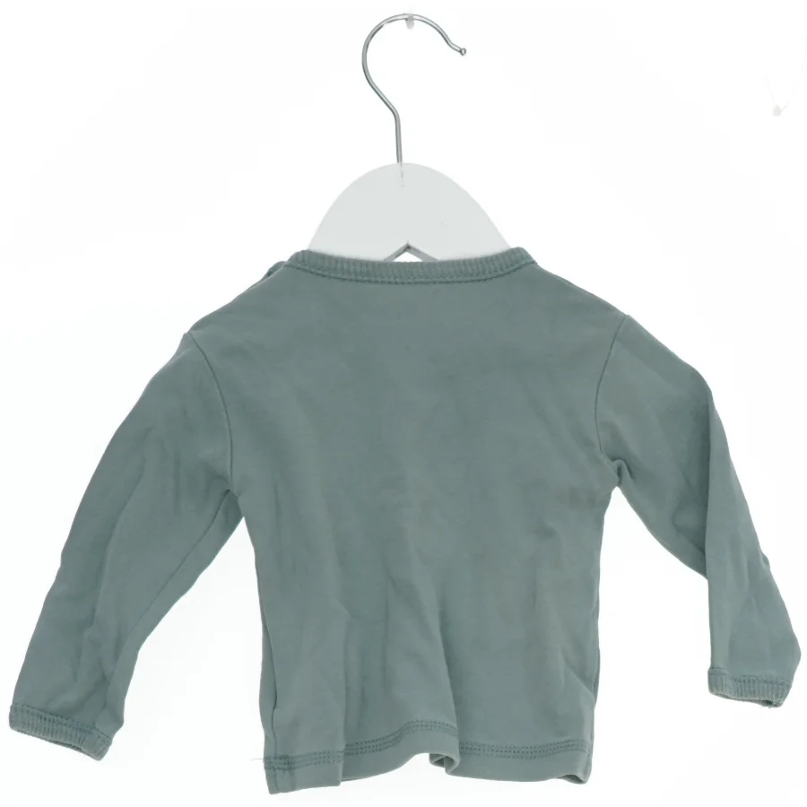 Langærmet bluse med motiv fra Fixoni (str. 62)