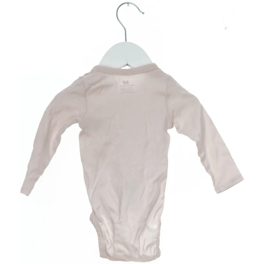 Langærmet bodystocking til baby fra H&M (str. 68)