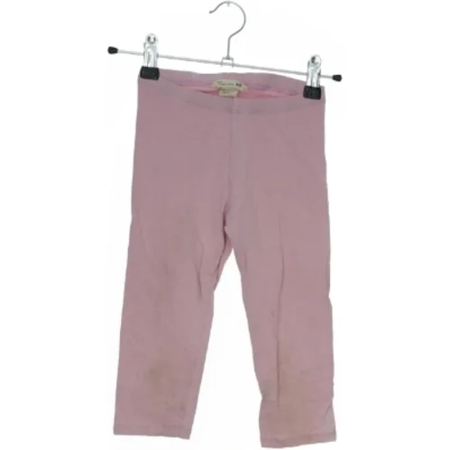 Lyserøde leggings fra H&M (str. 122)
