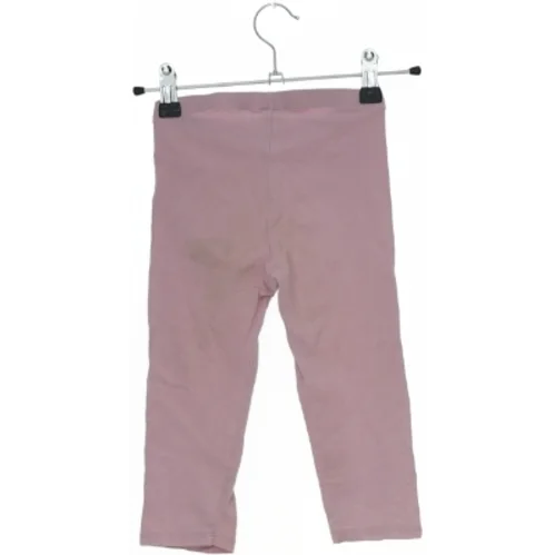 Lyserøde leggings fra H&M (str. 122)