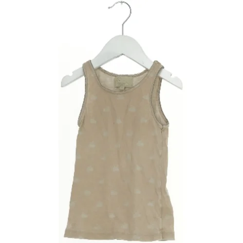 Tanktop med svanemotiv fra CamCam (str. 116)