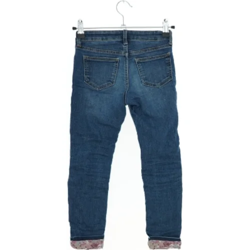 Skinnyfit lined jeans med blomstrede opslag fra H&M (str. 116)