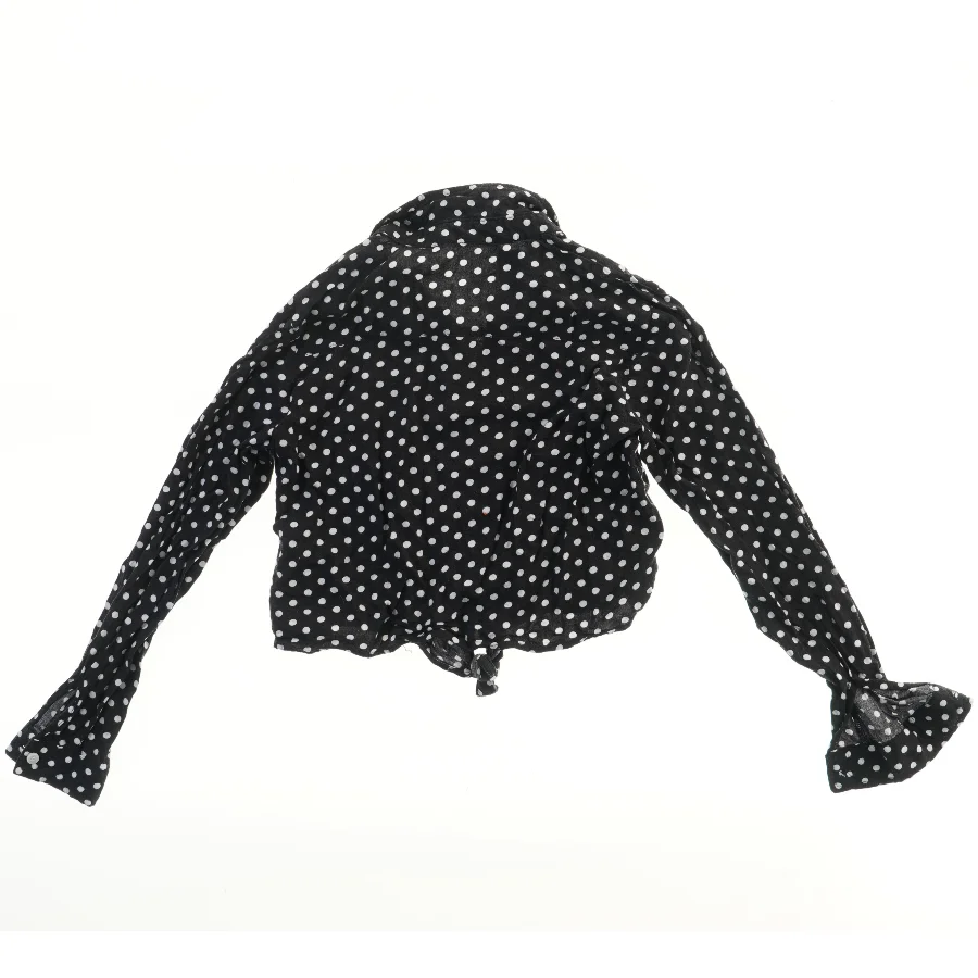 Prikket bluse med lange ærmer fra H&M (str. 140)