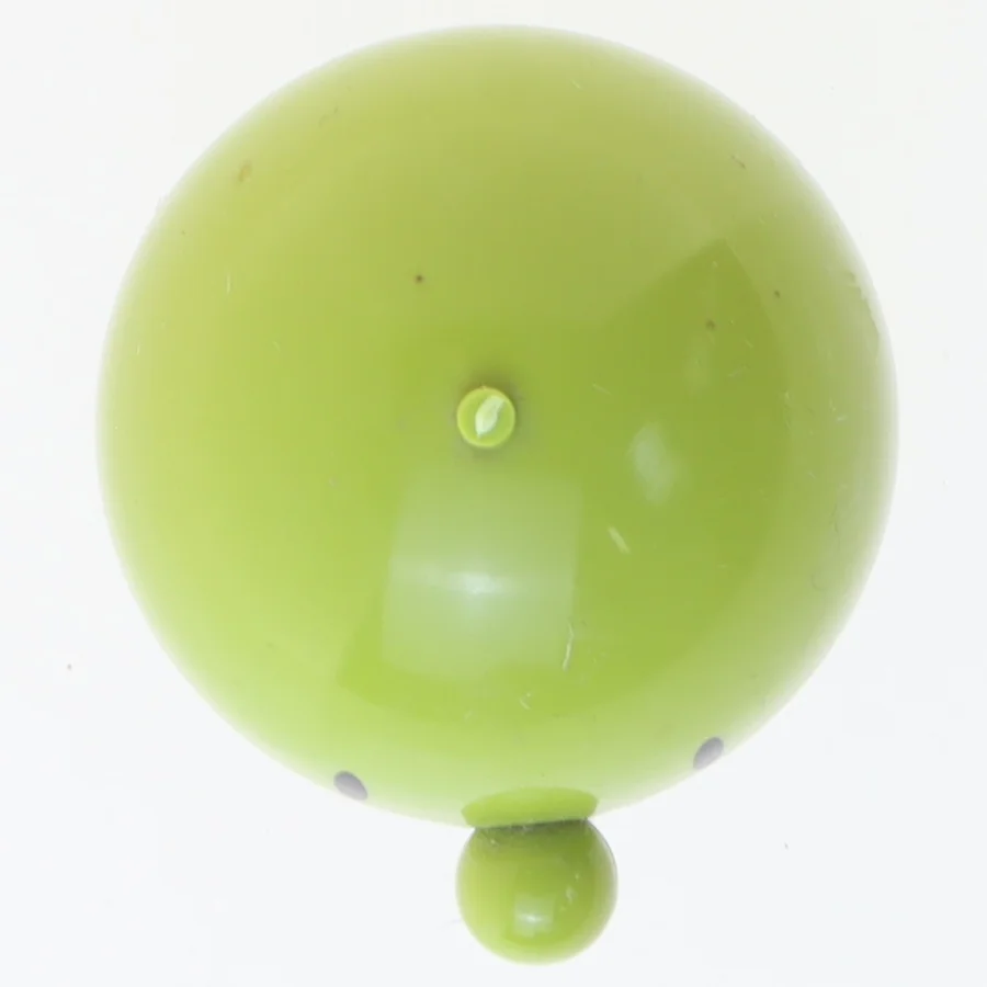 Grøn figur med fjeder fra Ehrenreich (str. 7x5 cm)