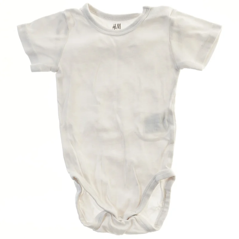 Hvid bodystocking til baby fra H&M (str. 68)